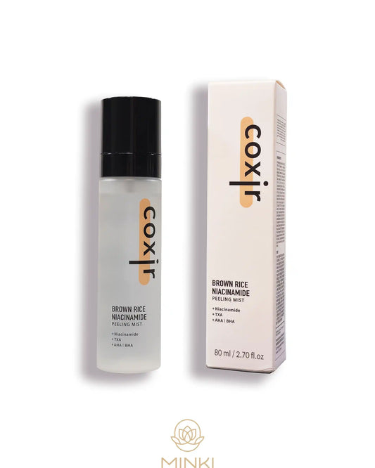 COXIR Brown Rice Niacinamide Peeling Mist en su envase junto a la caja original